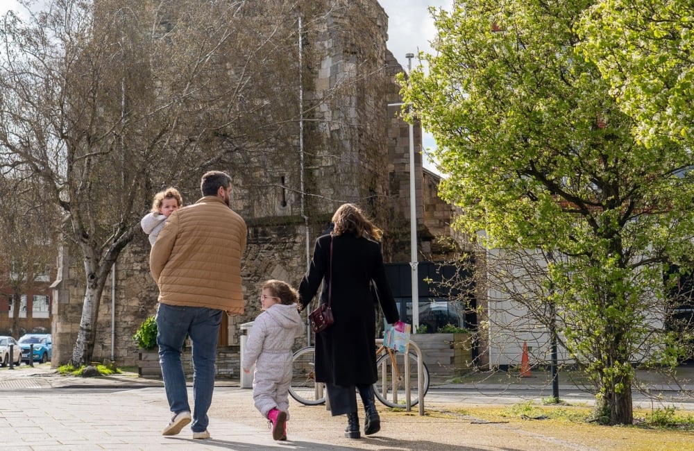 a family with two young children walking in southampton