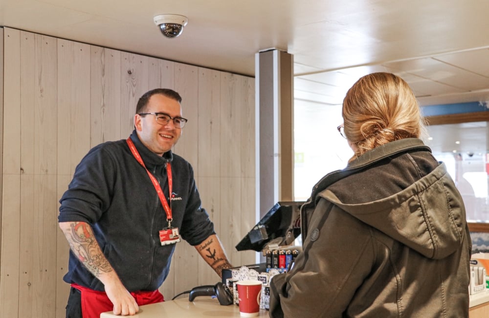 Food and Beverage staff helping a woman