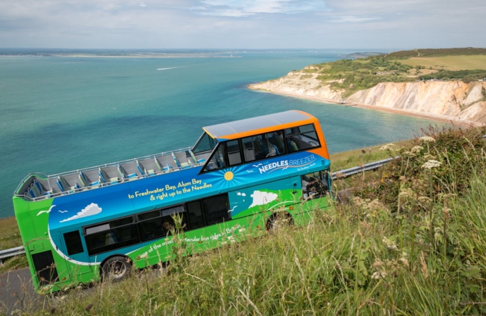 needles breezer bus with alum bay in the background