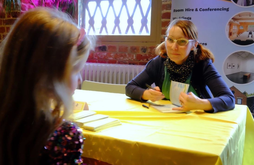 iw story festival author signing a book