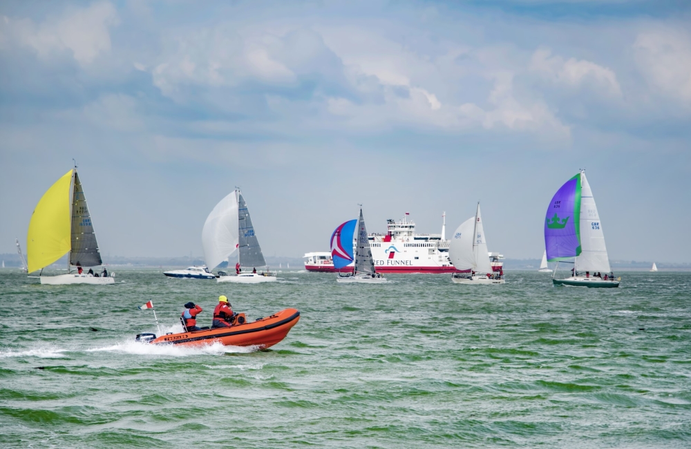 Cowes Week sailing with Red Funnel Ferry in background