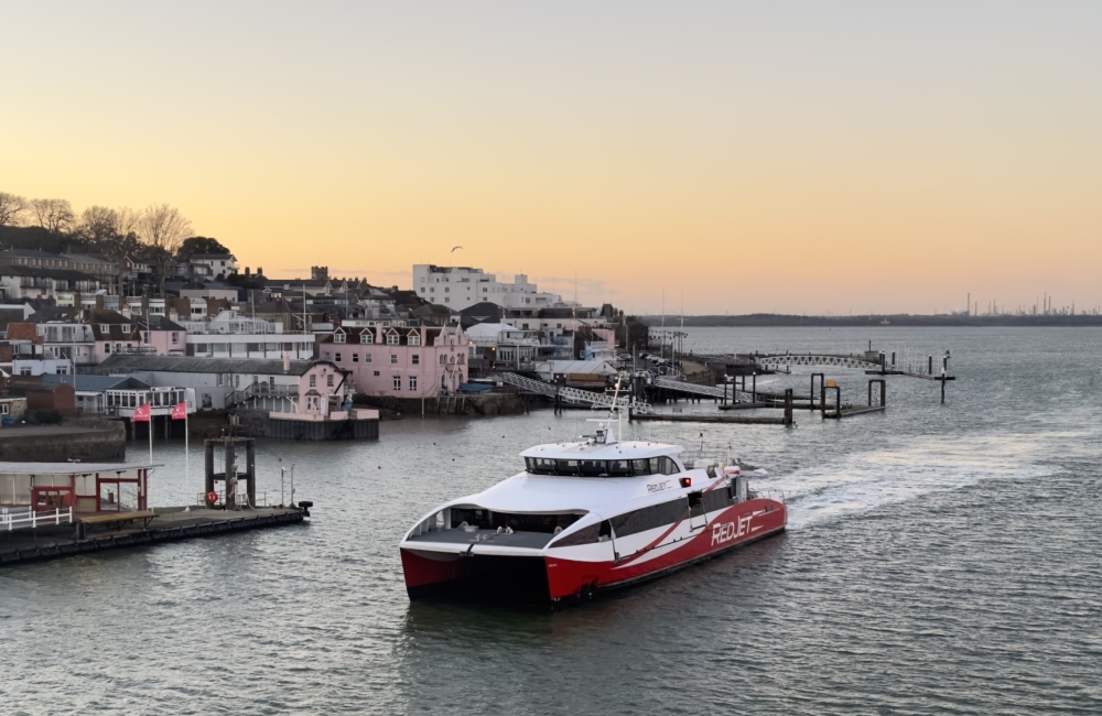 red jet entering cowes harbour