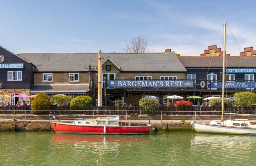 river with pub in background