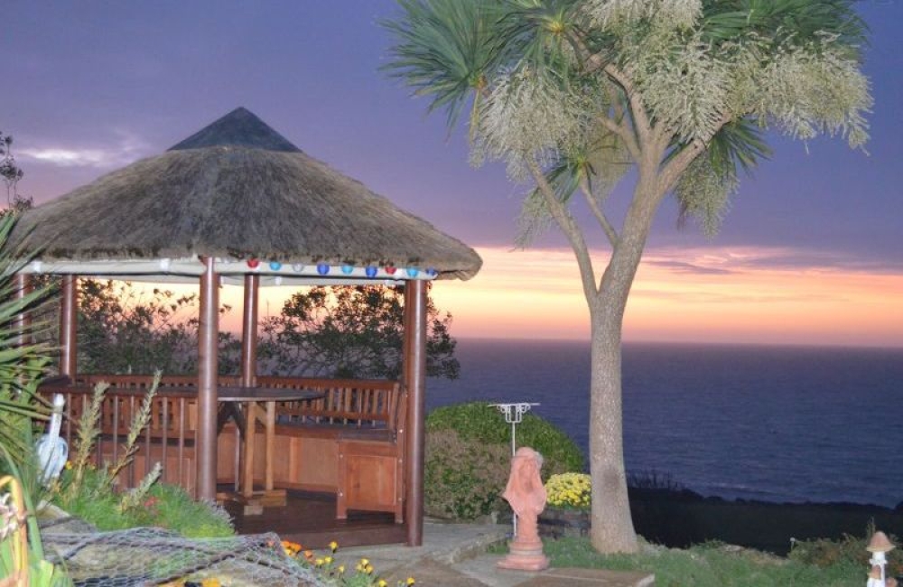 The Boat House Studio sunset view of the gazebo overlooking the sea