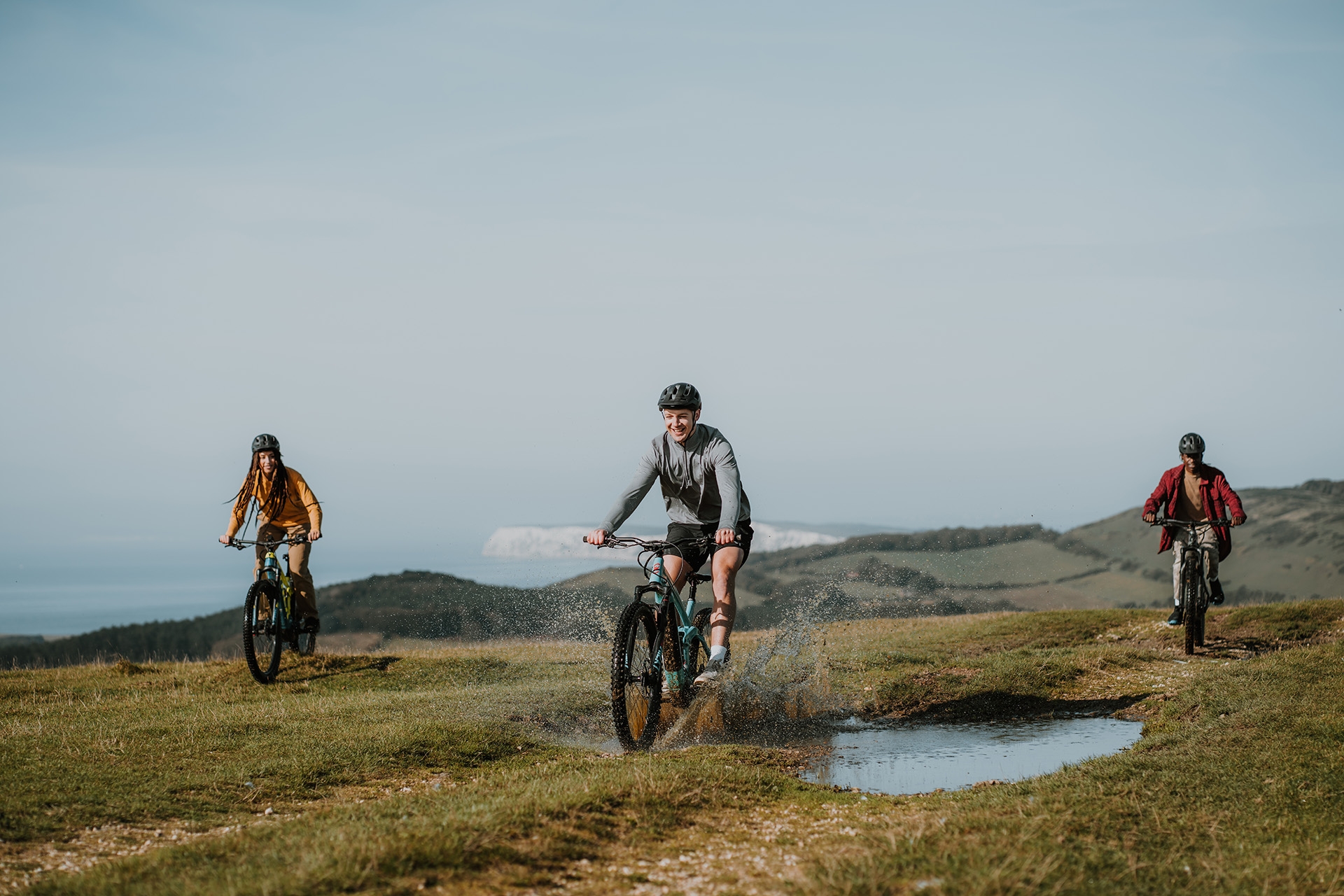 Group of friends mountain biking on a trail 