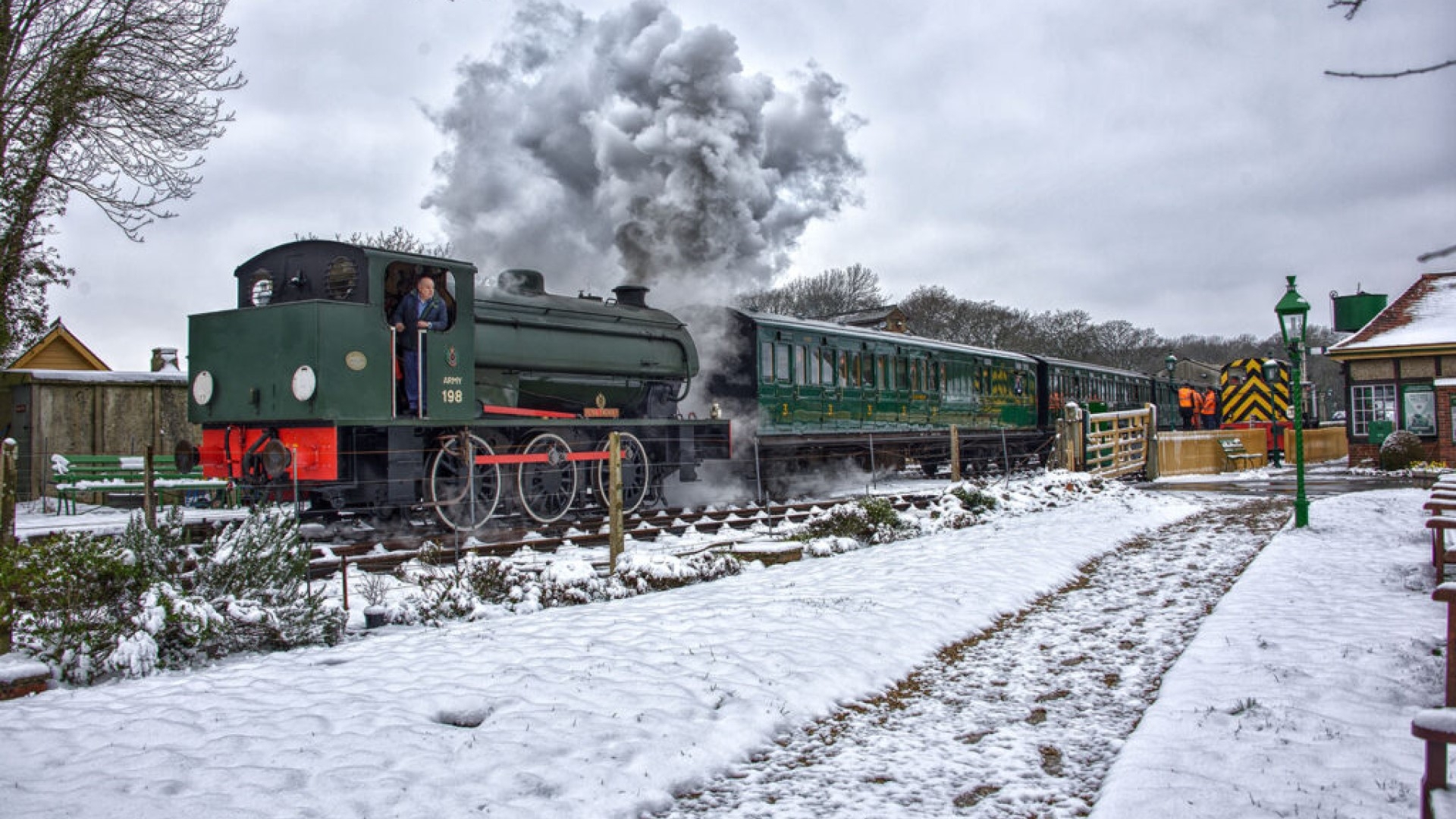 a steam train in the snow