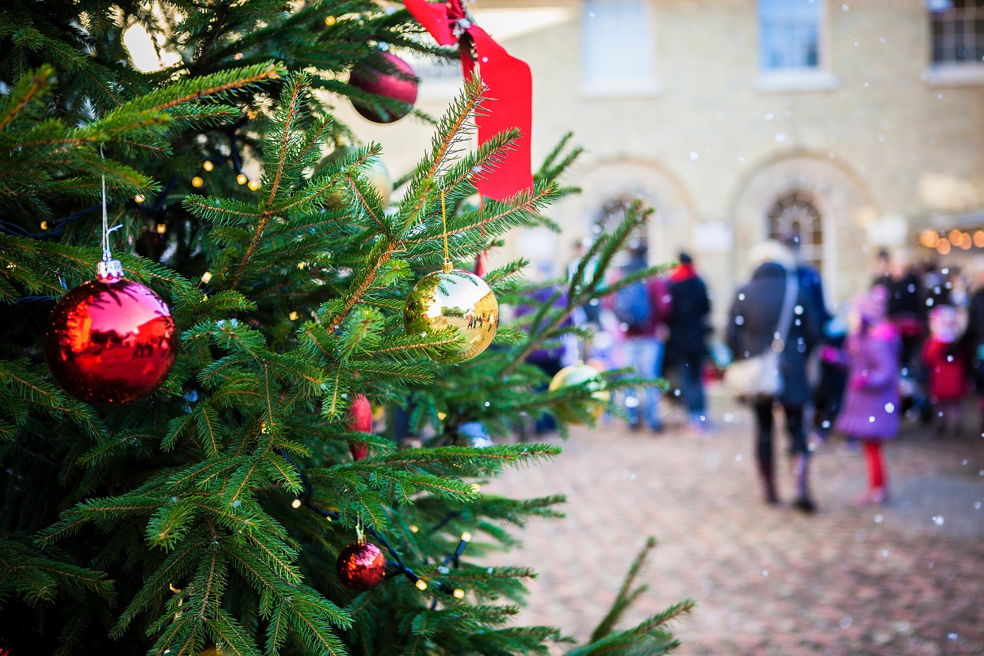 christmas tree with red baubles and ribbons