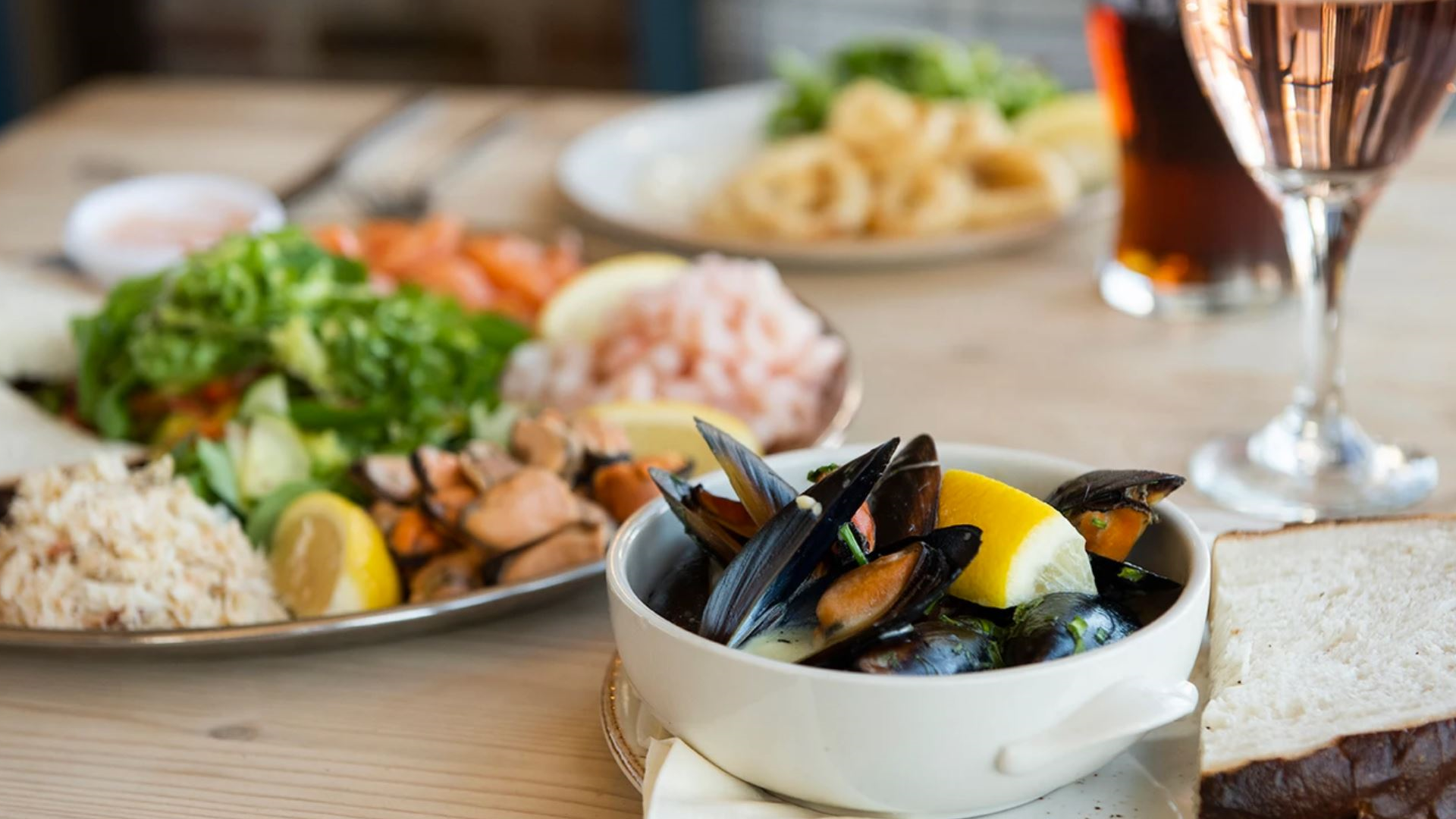 mussels with a platter containing crab, prawn and salad