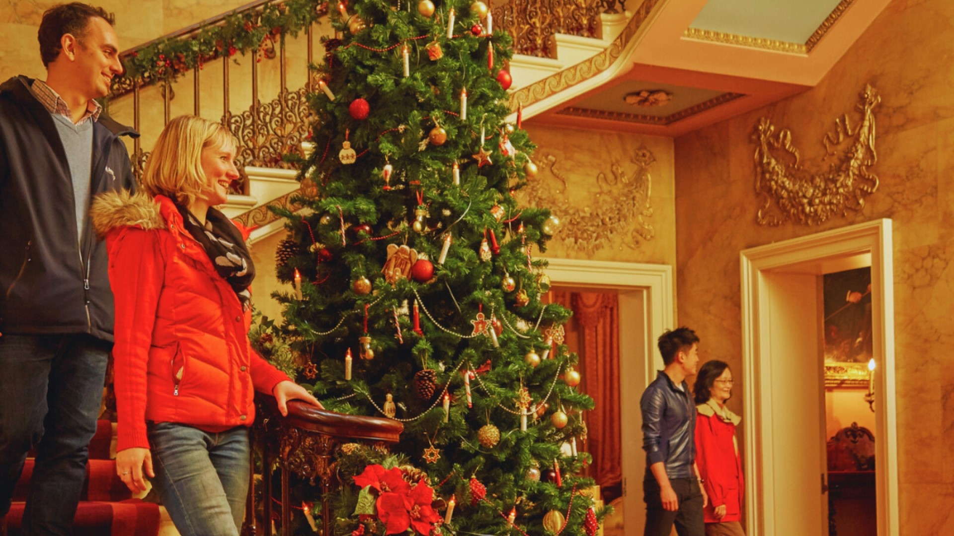 large decorated christmas tree inside the house