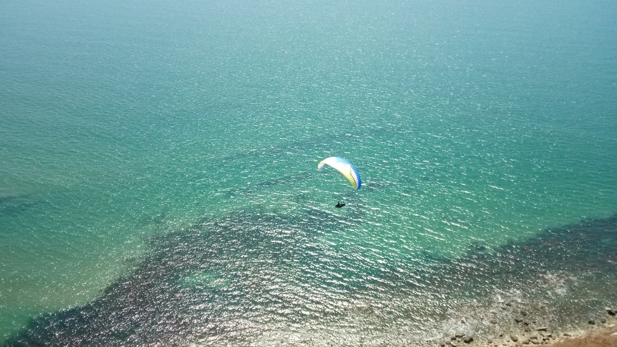 paragliding over the sea