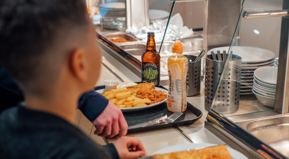 Waiting at Refuel cafe with chips and beans in the queue