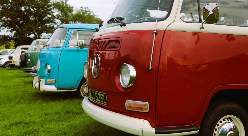 VW red and blue camper vans