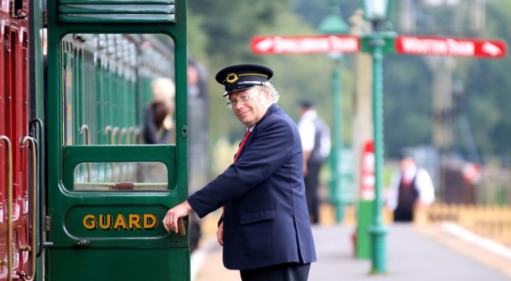 steam railway guard opening carriage door