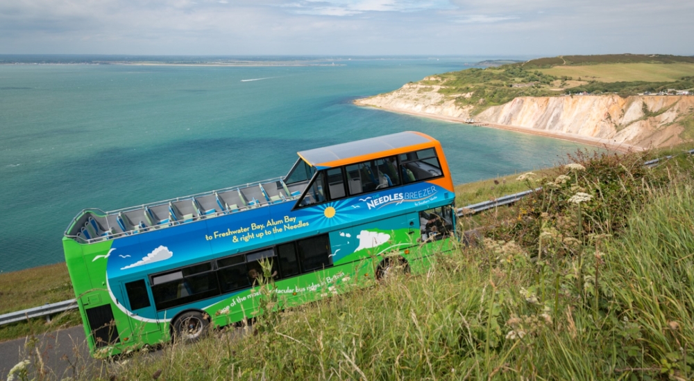 needles breezer bus with alum bay in the background