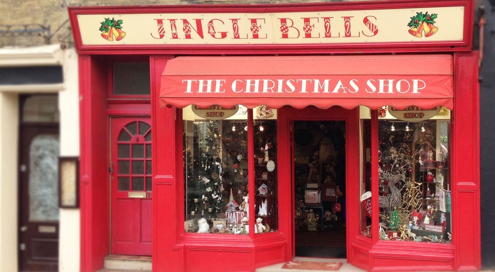 red shopfront of jingle bells