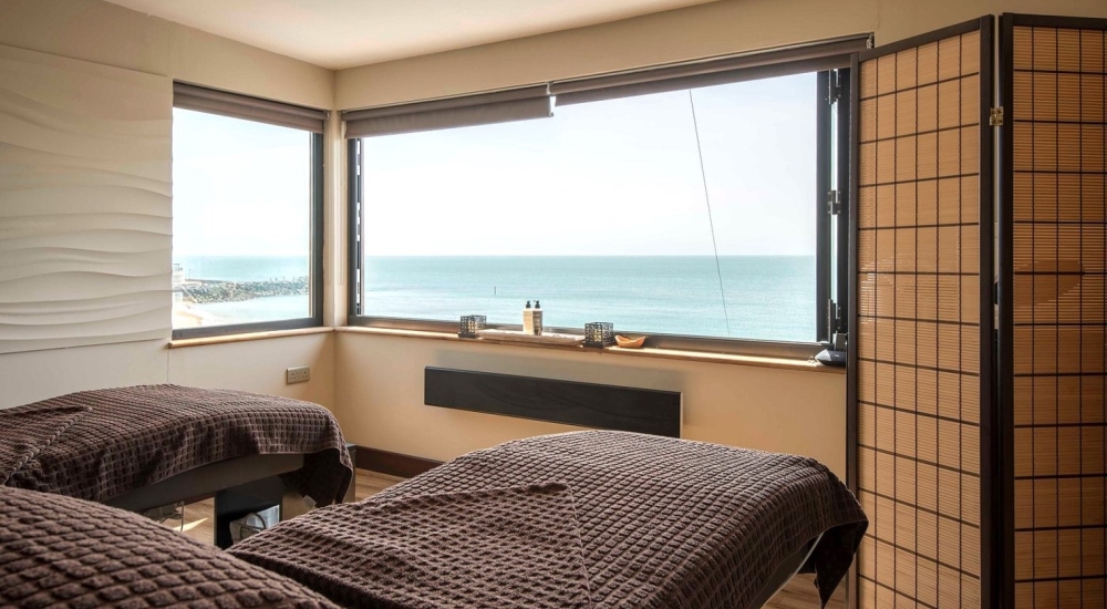 spa treatment beds overlooking the sea