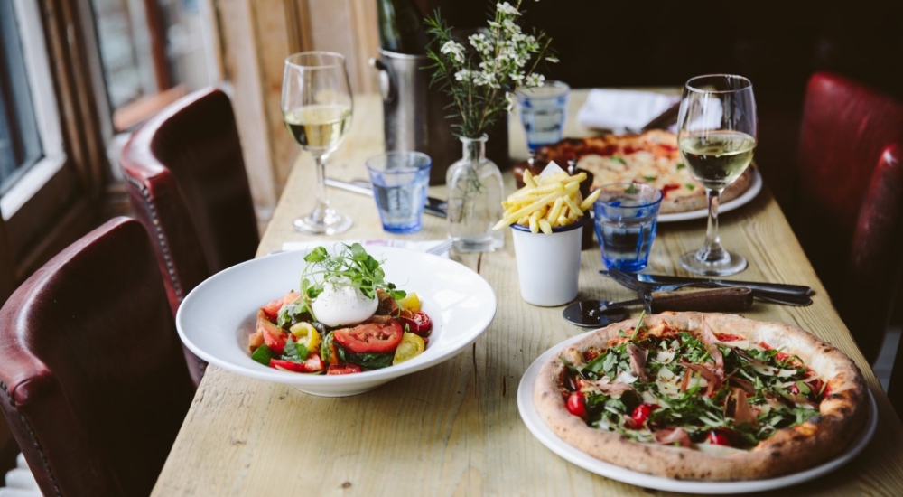 various dishes of food on restaurant table